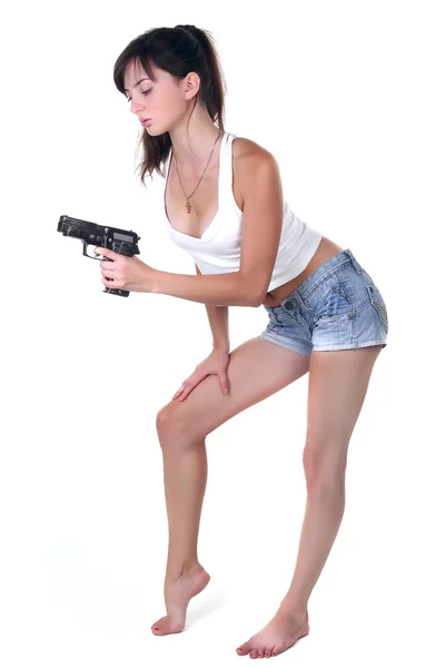 Menina sexual com arma no fundo branco — Fotografia de Stock
