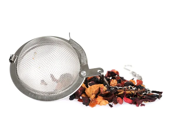Metal tea strainer with fruit tea — Stock Photo, Image