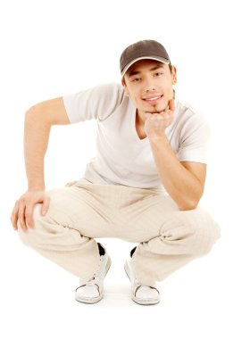 Smilling young man in a hat clipart