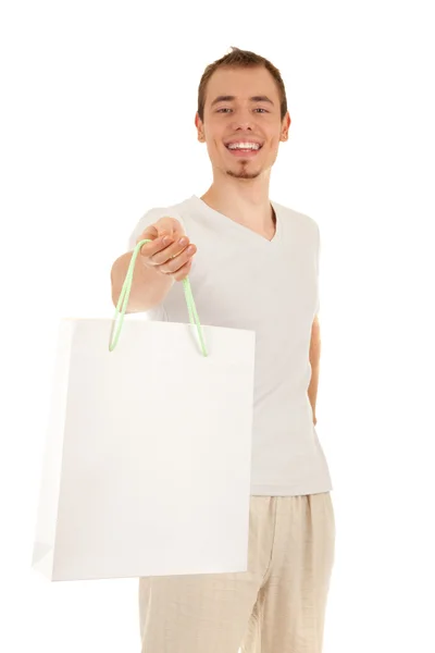 Yakışıklı adam beyaz kağıt çanta — Stok fotoğraf