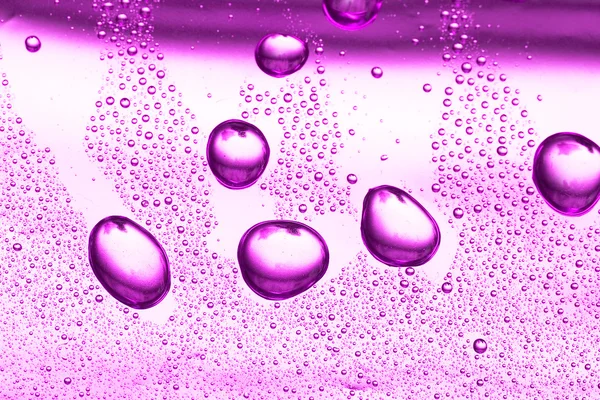Kropla wody fioletowy — Zdjęcie stockowe