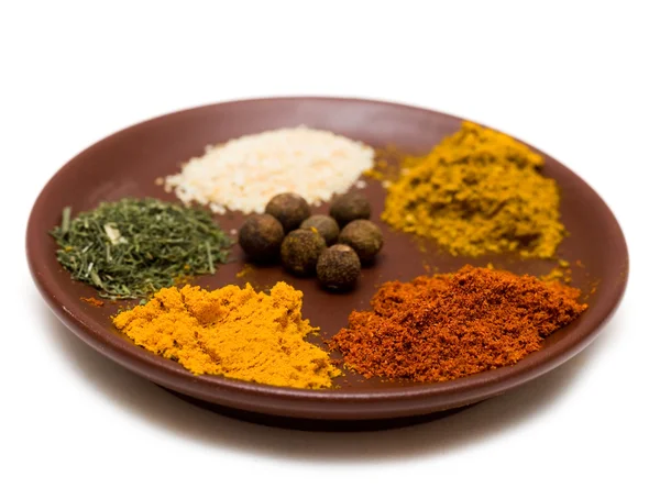 Many different spices in plate — Stock Photo, Image