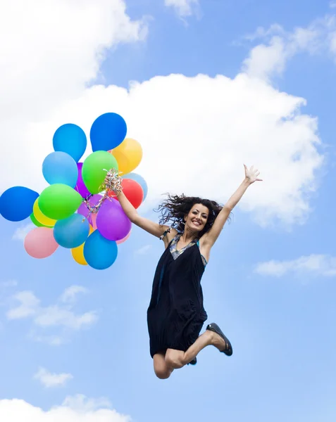 Glückliche Frau mit Luftballons — Stockfoto