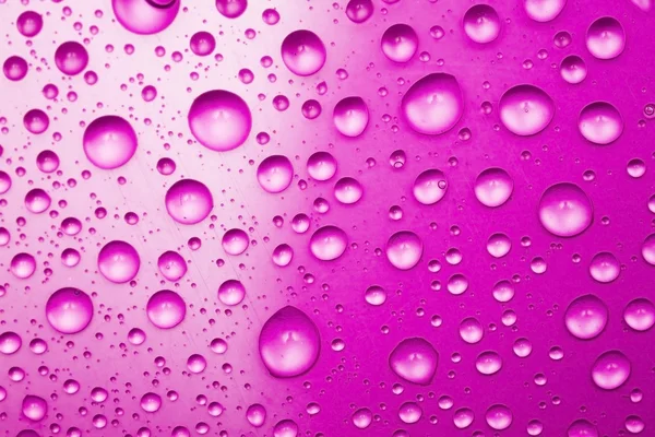 Violette Wassertropfen als Hintergrund — Stockfoto