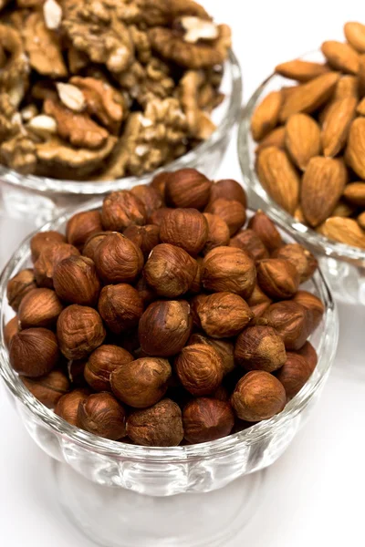 Many nuts in glass bowls — Stock Photo, Image