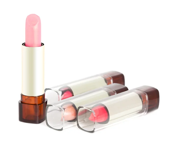 Rosa Lippenstifte auf weißem Hintergrund — Stockfoto