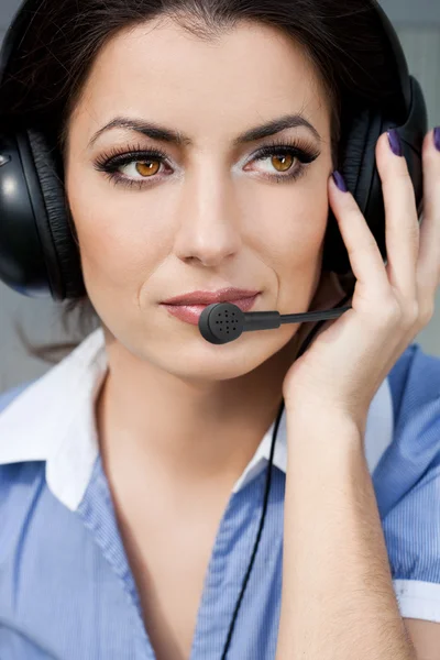 Girl commentator with headset on the tribune — Stock Photo, Image