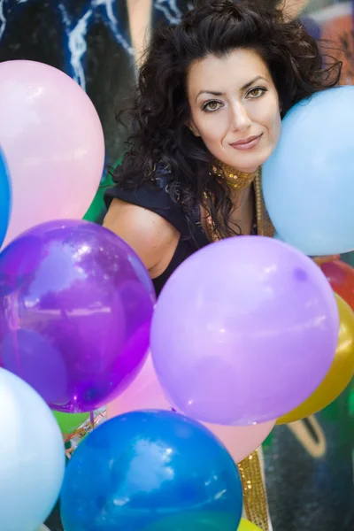 Stock image Happy woman with colorful balloons