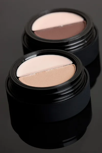 Brown make-up eyeshadows on black — Stock Photo, Image