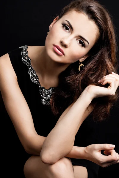 Beautiful fashioned woman on black background — Stock Photo, Image