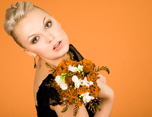 Woman with bouquet of flowers — Stock Photo, Image