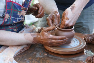 Potters hands with pot clipart