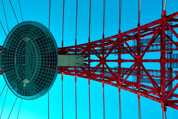 Vivid red suspension bridge — Stock Photo, Image