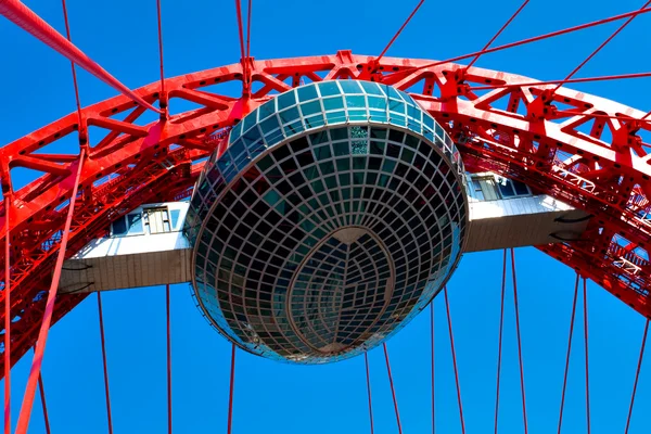 Vivid red suspension bridge — Stock Photo, Image