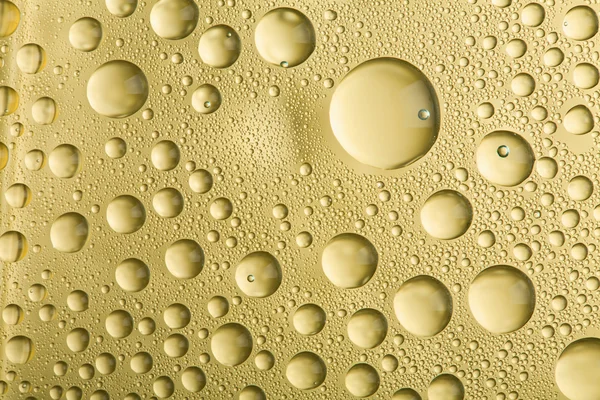 Golden water drops background — Stock Photo, Image