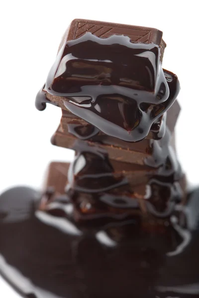 Syrup pouring onto chocolate — Stock Photo, Image