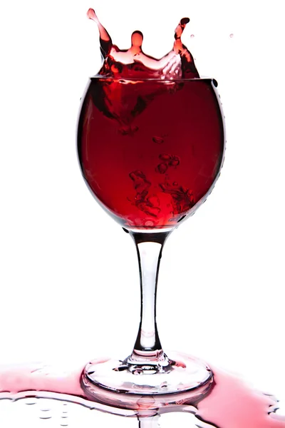 Red wine splashing in glass isolated — Stock Photo, Image