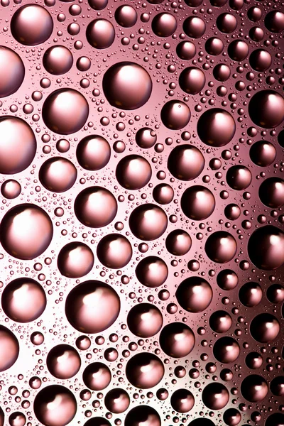 Roze water druppels achtergrond — Stockfoto