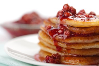 Sweet pancakes with strawberry jam isolated clipart