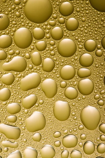 Acqua dorata gocce di sfondo — Foto Stock