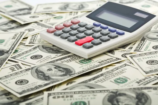 Dolarů a kalkulačka s plus červené tlačítko — Stock fotografie