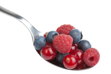 Fresh berries in spoon isolated clipart