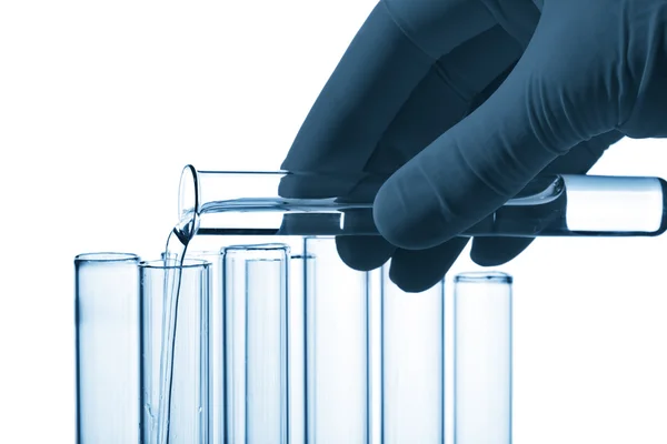 Hand pouring liquid into test tube isolated — Stock Photo, Image
