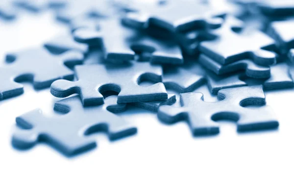 Pezzi di puzzle blu isolati — Foto Stock