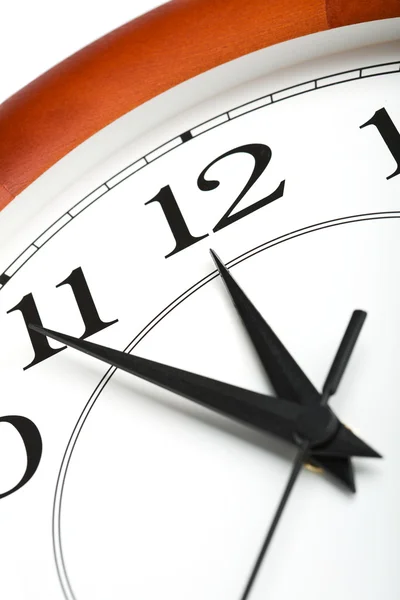 Round clock showing time about twelve isolated — Stock Photo, Image