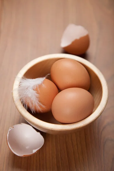 stock image Eggs in wooden bowl