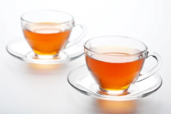Duas xícaras de chá sobre fundo branco — Fotografia de Stock