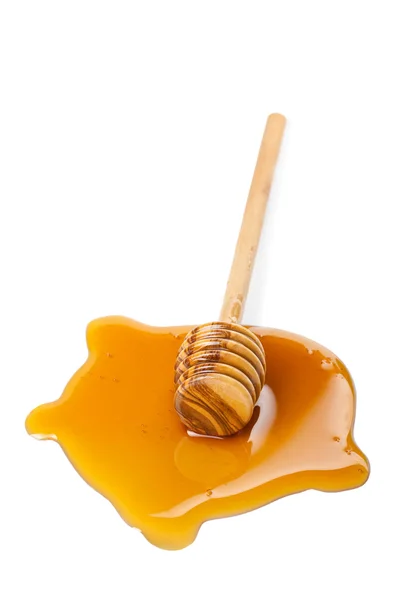 Honig und Holzdipper isoliert — Stockfoto