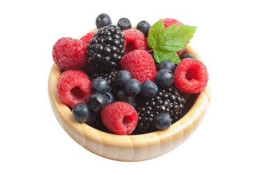 Fresh berries in wood bowl isolated