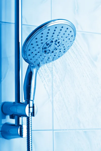 Water flowing from metal shower — Stock Photo, Image