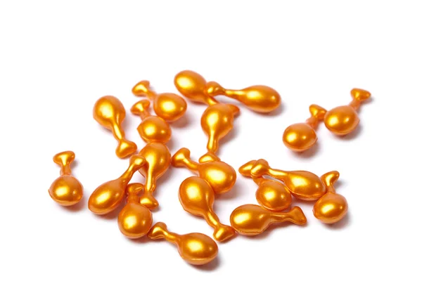 Cápsulas cosméticas laranja isoladas — Fotografia de Stock