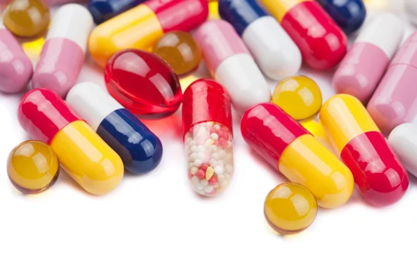 Pillole colorate isolate — Foto Stock