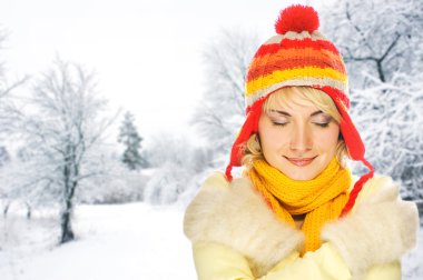 Beautiful young woman in winter clothing clipart