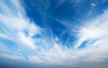 Blue sky with fluffy clouds clipart