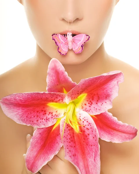 Butterfly sitting on a lips of a beautiful woman. Isolated on wh — Stock Photo, Image