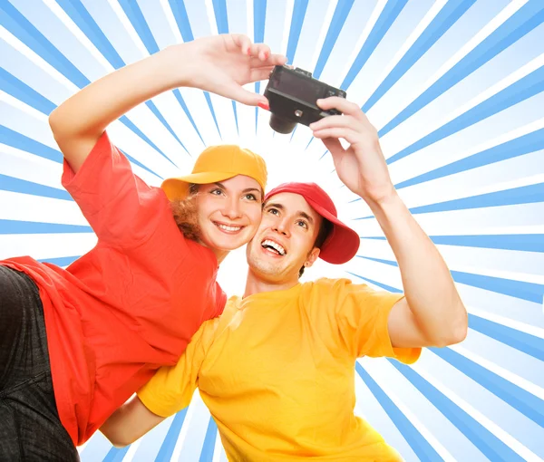 Young couple photographing themselves — Stock Photo, Image