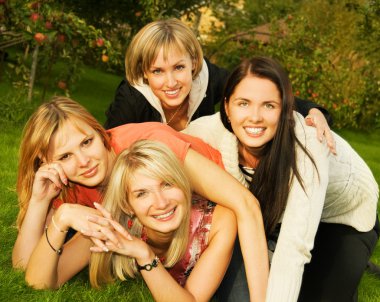 Group of happy friends having fun outdoors clipart