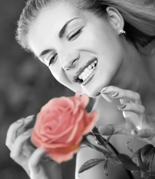 Evil young woman with a rose — Stock Photo, Image
