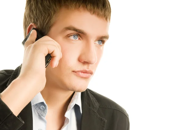 Молодой красивый мужчина разговаривает по телефону — стоковое фото