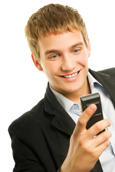 Mladý šťastný muž drží mobilní telefon — Stock fotografie