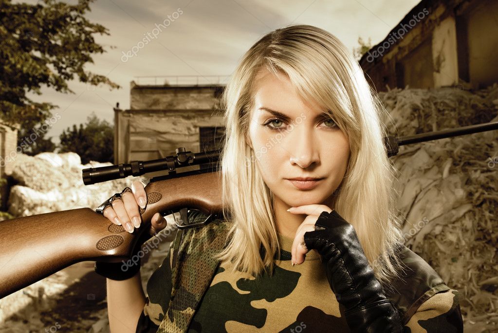 Beautiful woman soldier with a sniper rifle — Stock Photo © nejron #4791430