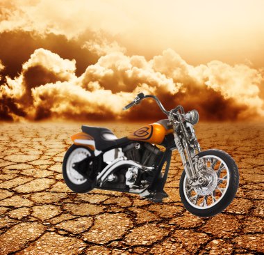 Motorcycle in a desert clipart