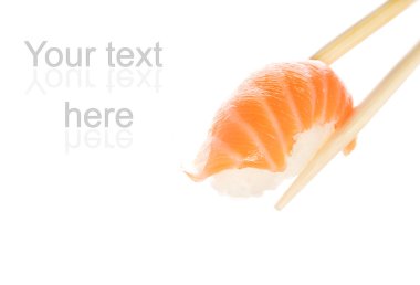 Wooden chopsticks holding salmon sashimi clipart