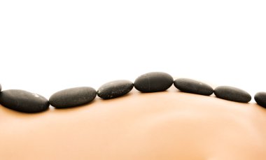 Massage with hot stones clipart