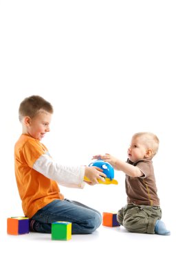 Two kids playing together over white background clipart