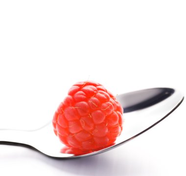 Ripe raspberry in silver spoon isolated on white background clipart